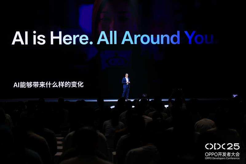 A person standing on a stage with a large screen behind him

AI-generated content may be incorrect.